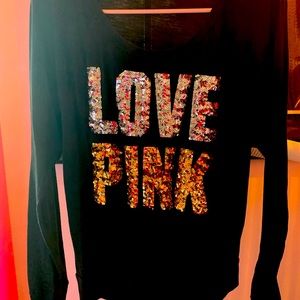 Pink brand long sleeved T-shirt with gold and silver sequins. Size is Small